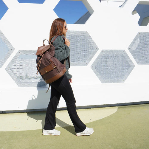 ELLE Eleganza 25L Monogram Backpack in brown demonstrating practical use - premium ELLE collection