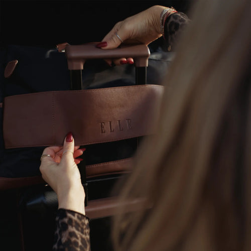 ELLE Luxe Journey 30L Twill and Vegan Leather Weekender Duffel Bag in black demonstrating practical use