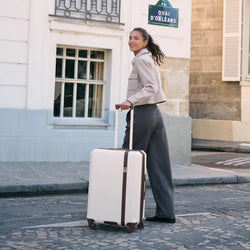 ELLE Luxe Journey 3 Piece Expandable Retro Spinner Luggage Set in champagne demonstrating practical use