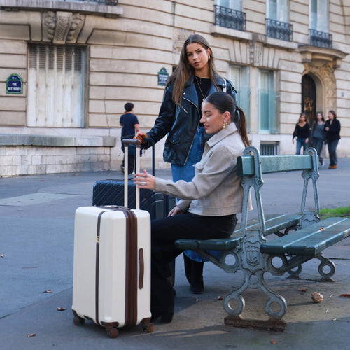 ELLE Luxe Journey 3 Piece Expandable Retro Spinner Luggage Set in champagne demonstrating practical use