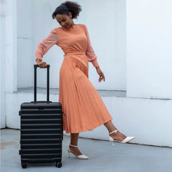 ELLE Excursion Expandable Chick 3-Piece Luggage Set in Black demonstrating practical use