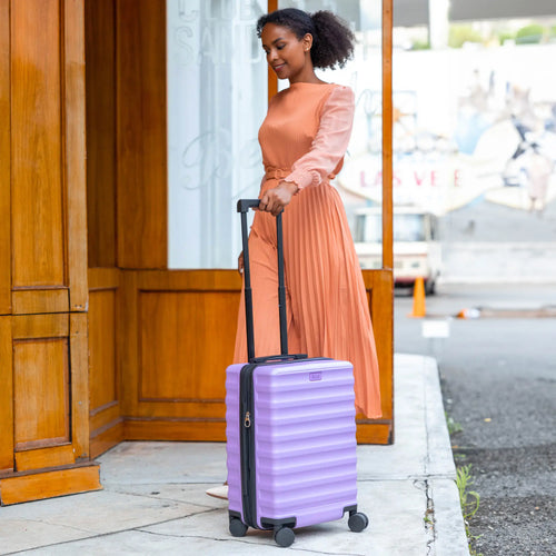 ELLE Excursion Expandable Chick 3-Piece Luggage Set in Black demonstrating practical use