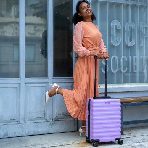 ELLE Excursion Expandable Chick 3-Piece Luggage Set in Black demonstrating practical use