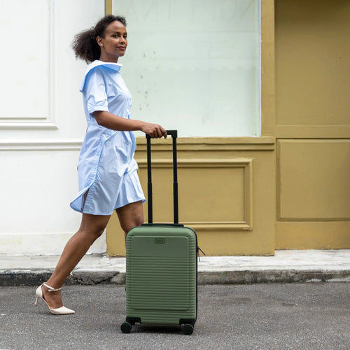 ELLE Passage Expandable Sleek 3-Piece Luggage Set in White demonstrating practical use