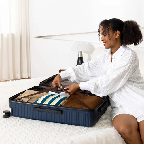 ELLE Passage Expandable Sleek 3-Piece Luggage Set in White demonstrating practical use