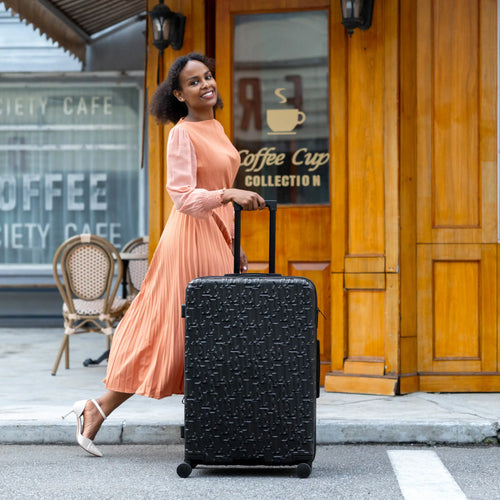 ELLE Wayfarer Expandable Sleek Monogram 3-Piece Luggage Set in Navy demonstrating practical use