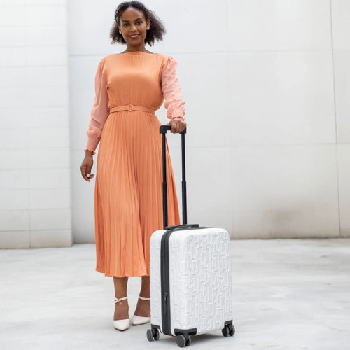 ELLE Wayfarer Expandable Sleek Monogram 3-Piece Luggage Set in Navy demonstrating practical use