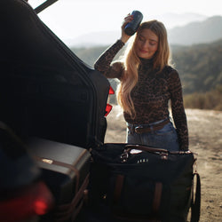 ELLE Luxe Journey 30L Twill and Vegan Leather Weekender Duffel Bag in black demonstrating practical use