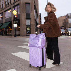 ELLE Voyage 25L Twill and Vegan Leather Weekender Tote Bag in lavender demonstrating practical use